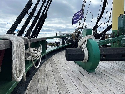 The deck and bow of a large wooden ship.