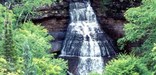 Chapel Falls cascades into Chapel Lake below, one of many waterfalls in Pictured Rocks National Lakeshore.