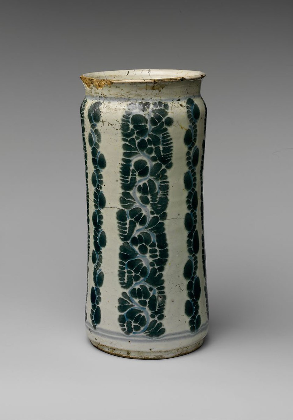 Small white apothecary jar with green scroll pattern. Circa 1800 from Mexico.