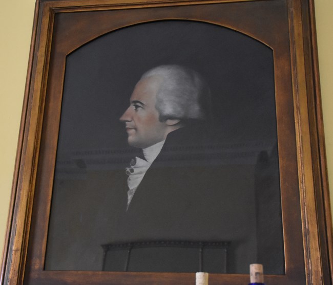 A painting of a profile portrait of Alexander Hamilton.