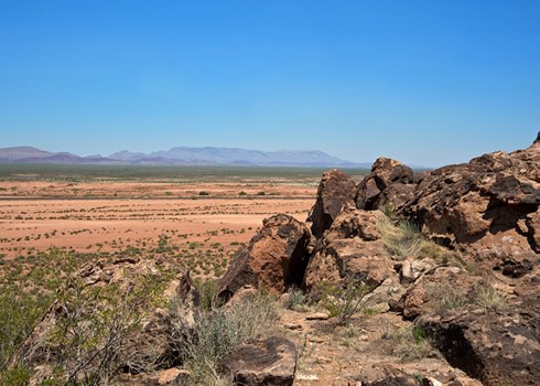 The large basalt outcropping known as Point of Rocks was a welcome natural landmark for El Camino Real travelers making their way through the dry and dangerous Jornada del Muerto. Photo © Jack Parsons