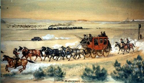 A stagecoach is pulled by a team of horses.