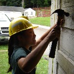 Photo park employee repairing building.