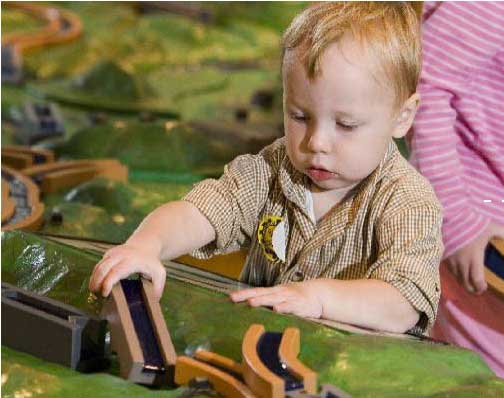 Photo of child learning to build a canal. Photo of child learning to build a canal.