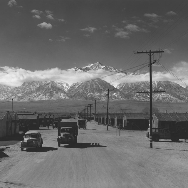Relocation camp in World War with mountain backdrop