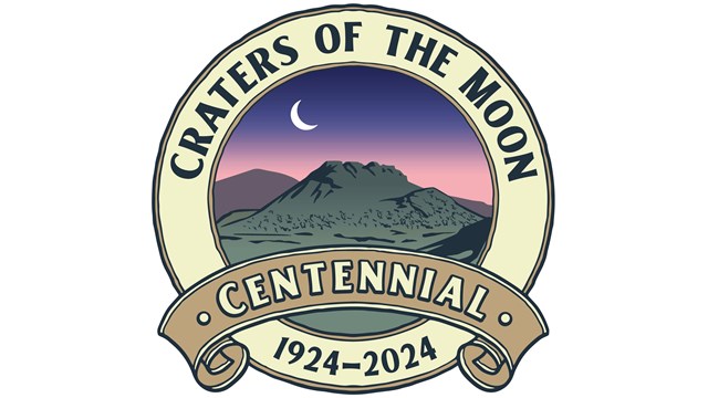 logo of a spatter cone at evening with the text "craters of the moon centennial, 1924-2024"
