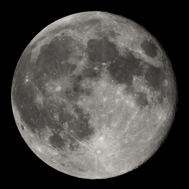 Close up image of the moon, displaying craters. 