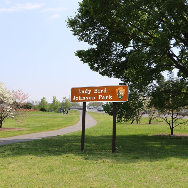 A park with the sign reading Lady Bird Johnson Park