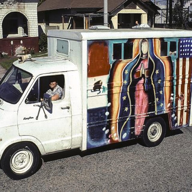 Ice cream truck with the Virgin Mary and American Flag painted on it