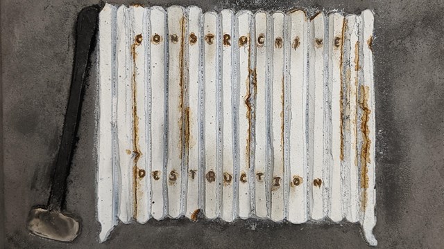 Cast iron artwork depicting a radiator.