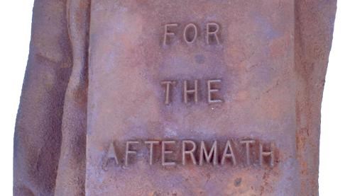 Cast iron in the form of gloves with the words "For the Aftermath" written on them