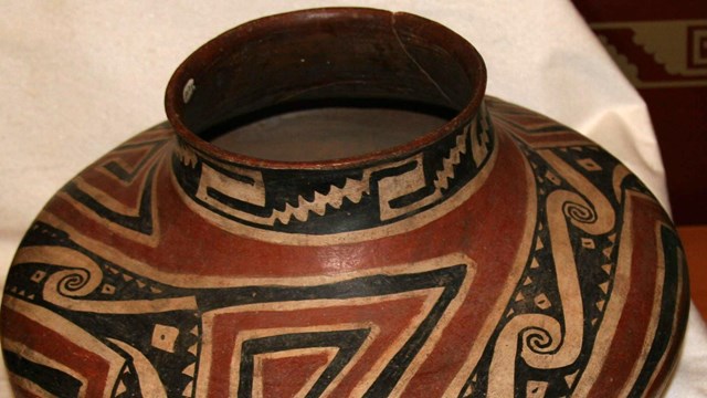 Red, black, and white pot