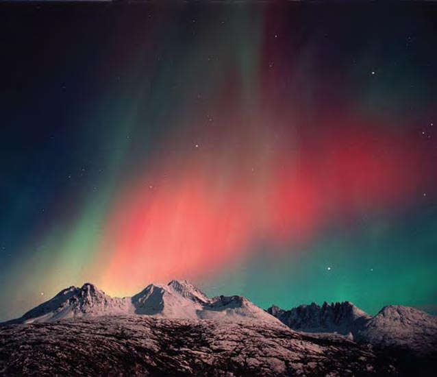 Red aurora over the Sawtooth Mountains.