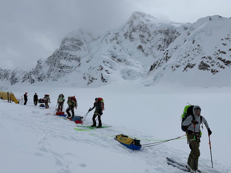 Davis and team at base camp 2025-06-09-12-58-02 7 mountaineering rangers in a row on skis