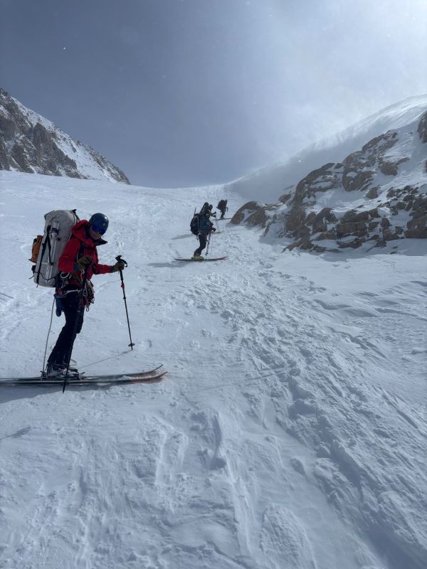Patrol 1 Squirrel Hill Conditions Photo Three rangers on skis in a line going up a snowy ridge