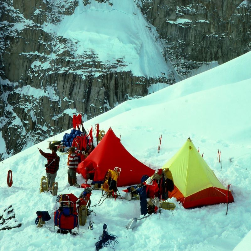 South Buttress Photo Overhead of a mountaineering camp with a red tent and yellow tent