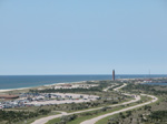 Aerial view of parking lot and winding two-lane roadway, with Robert Moses State Park water tower in background. Aerial view of parking lot and winding two-lane roadway, with Robert Moses State Park water tower in background.