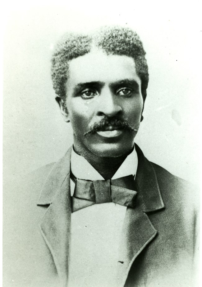 Yearbook portrait of George Washington Carver.