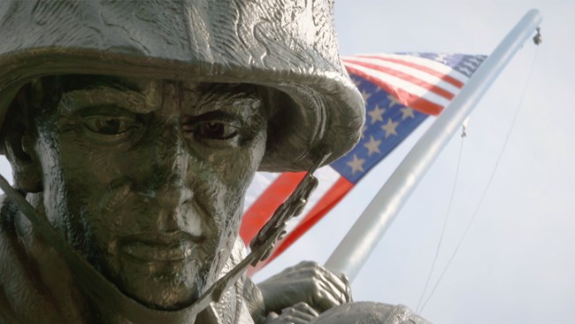 Closeup of statue with American flag
