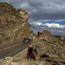 Photo car traveling past rock cut on Trail Ridge Road Photo car traveling past rock cut on Trail Ridge Road