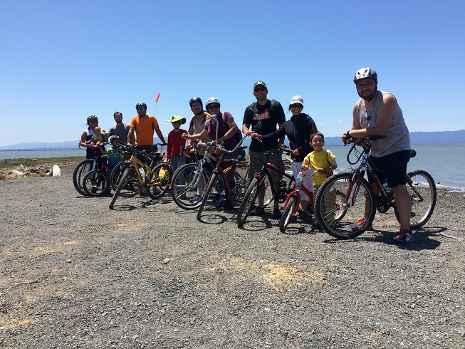 Group of bike riders on a trail by the Bay. Group of bike riders on a trail by the Bay.
