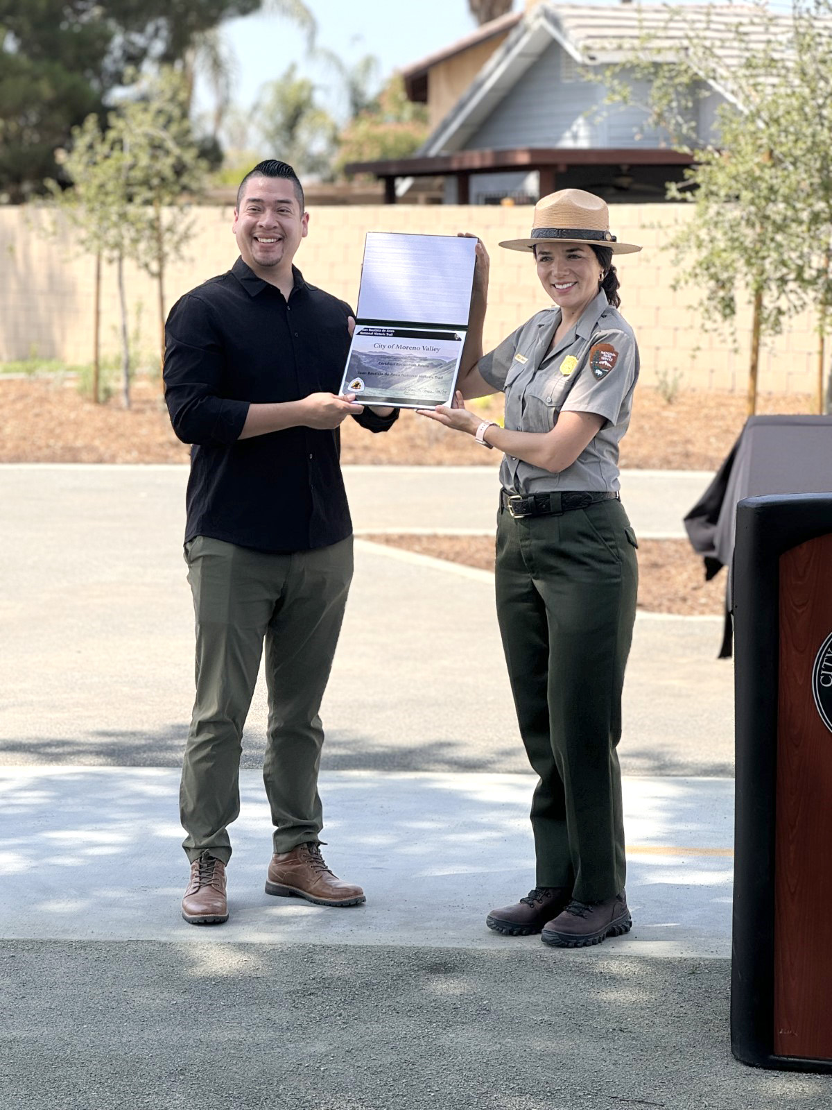 Moreno Valley Trail Dedication A woman in National Park Service uniform and a man hold a certificate
