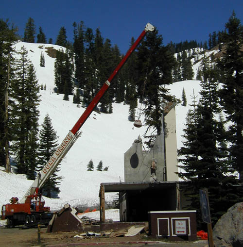 a wrecking ball is bringing down the old ski chalet
