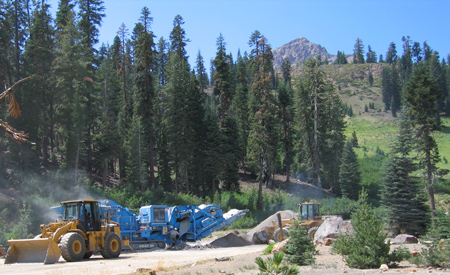 bulldozers and rock crushers in action