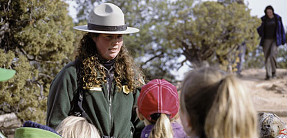 Visitors enjoy a guided walk at Natural Bridges