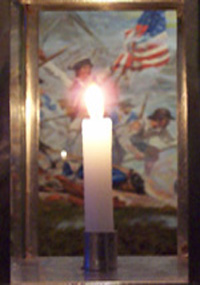 Lit candle infront of historic battle painting Lit candle infront of historic battle painting