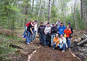 High school students proudly pose with the work they accomplished along this trail. High school students proudly pose with the work they accomplished along this trail.