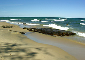 The remains of a shipwreck on the beach between Hurricane River and the Au Sable Light Station. The remains of a shipwreck on the beach between Hurricane River and the Au Sable Light Station.
