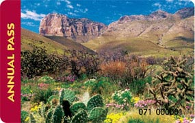 The America The Beautiful annual pass features a desert scene with mountains in the background. The America The Beautiful annual pass features a desert scene with mountains in the background.