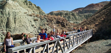 Image of kids on a bridge at Blue Basin.