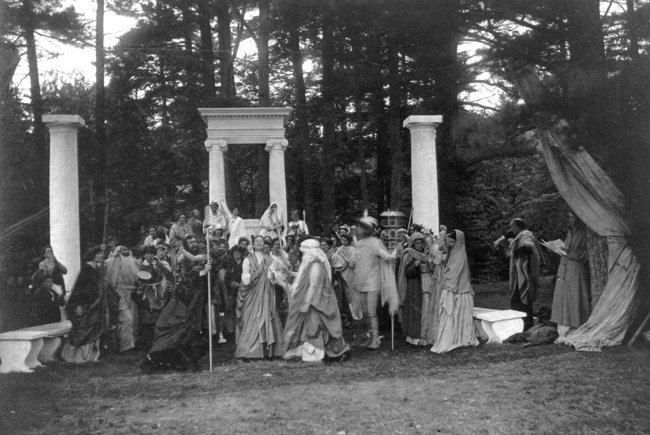 black and white photo of group dressed in classical-inspired costumes