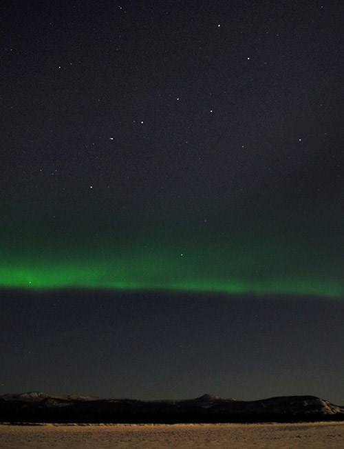 Ursa Major over Yukon River (YUCH) - 500 Stars of the big dipper over a green glow in the big night sky.