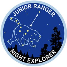 The Ursa Major constellation (the bear) is featured on this illustration of the Junior Ranger Night Explorer patch.