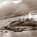 A plume from a torpedo explosion erupts alongside USS Oklahoma.