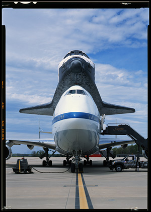 Orbiter Discovery (OV-103) sitting atop the Shuttle Carrier Aircraft (SCA) on the tarmac at Dulles International Airport as it is being delivered to the Smithsonian Institution's Air and Space Museum's Udvar-Hazy Center. Photographer: Jet Lowe, HAER Photographer, April 2012.