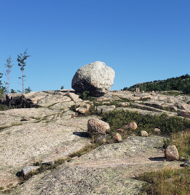 A large boulder left by glaciers sits along the Penobscot Mountain Trail.