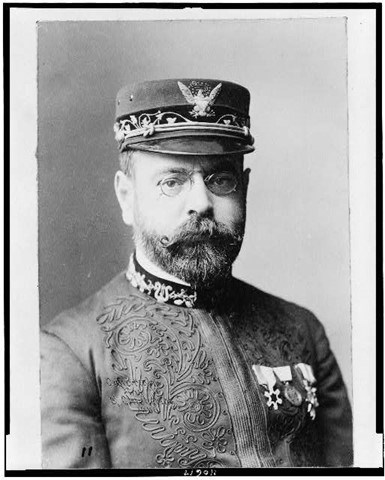 A black and white photo of a man in a uniform