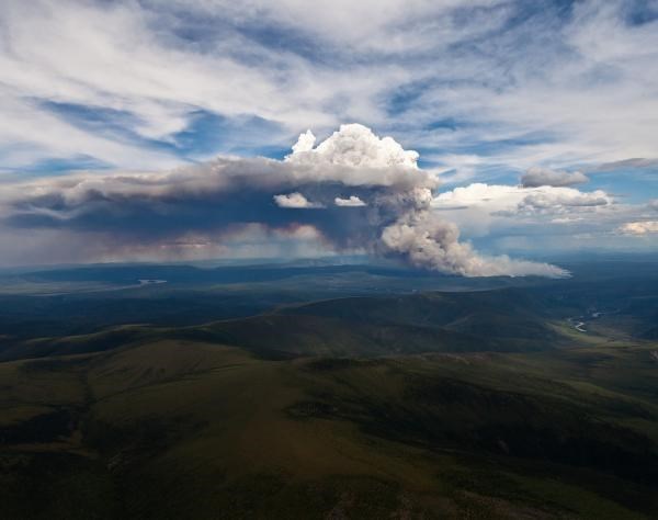 A cloud of smoke billows out from the Marie Creek wildfire in Alaska.