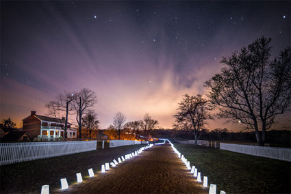 view of the road going in front of the McLean House at sunset