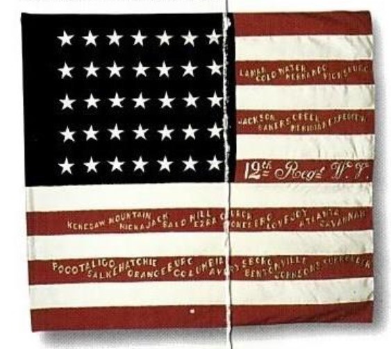 American Flag with ornate golden writing on the red stripes