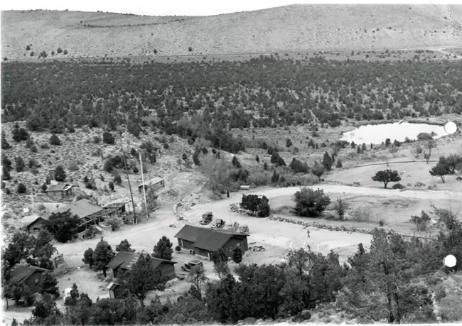 View of Rhodes Cabin in 1940 before Lehman Caves Visitor Center was built. Not much pinyon juniper cover.