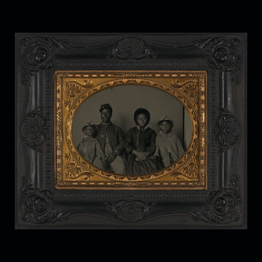 A photograph of an unnamed USCT soldier with his wife and two daughters.