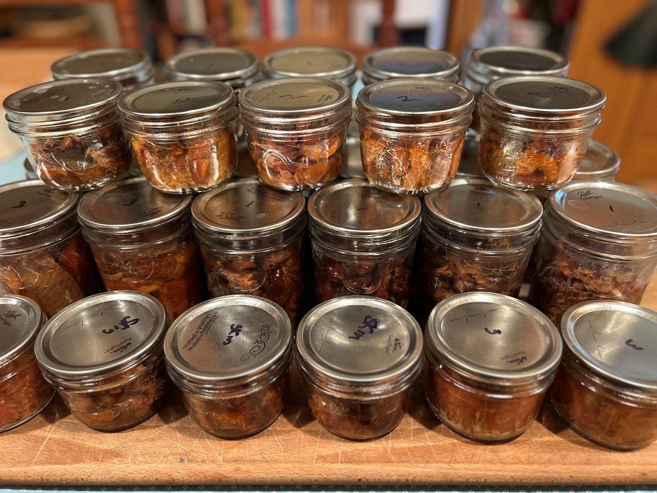 Smoked Salmon Small, sealed glass jars filled with salmon.