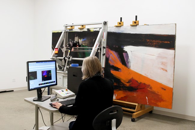 Cory Rogge using a Bruker M6 scanning XRF instrument to analyze Orange and Black Wall, 1959, by Franz Kline, oil on canvas, the Museum of Fine Arts, Houston, bequest of Caroline Wiess Law. Cory Rogge using a Bruker M6 scanning XRF instrument to analyze Orange and Black Wall, 1959, by Franz Kline, oil on canvas, the Museum of Fine Arts, Houston, bequest of Caroline Wiess Law.