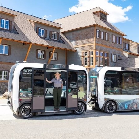 Testing Automated Vehicle Technology a park ranger standing in the doorway of an electric vehicle