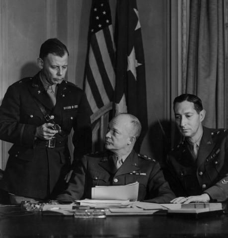 A black and white image of three officers in uniform